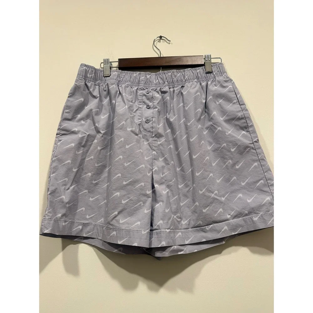 Nike women's Sportswear Woven Swoosh Shorts‎ Lavender Purple All Over Print L